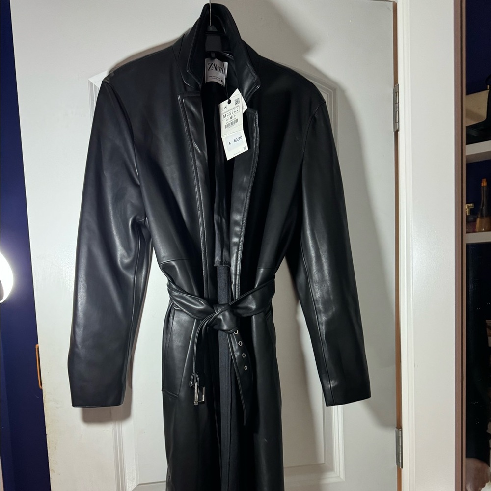 A faux leather black trench coat